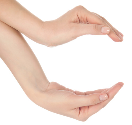 Stretched hand of woman isolated over white background. Open palm hand gesture of woman hand. Close up of open palm isolated over white background.の写真素材