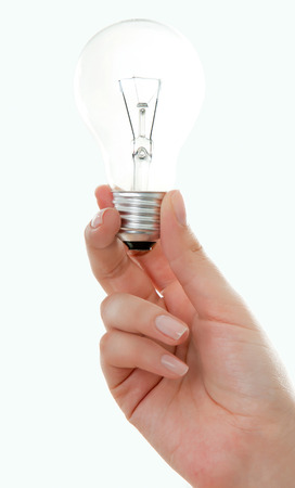 light bulb (lamp) in hand Isolated on white backgroundの写真素材