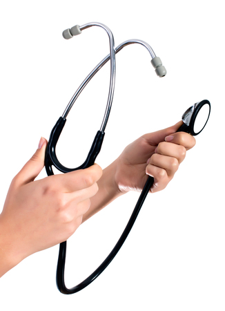 Doctor's hands holding stethoscope.Studio shot isolated on whiteの写真素材