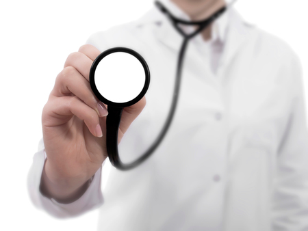 Doctor's hands holding stethoscope.Studio shot isolated on whiteの写真素材