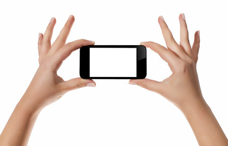Hand with smart phone white screen isolated on white background with clipping pathの写真素材