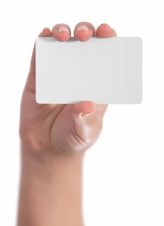Woman hand hold virtual business card, credit card or blank paper isolated on white background.Clipping path included.Hand holding blank business card with clipping pathsの写真素材