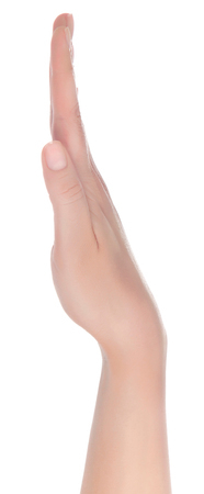 Stretched hand of woman isolated over white background. Open palm hand gesture of woman hand. Close up of open palm isolated over white background.の写真素材
