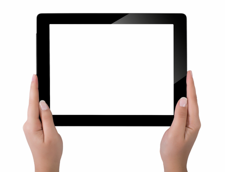 Hand holding a tablet computer with white screen. Woman hands showing empty screen of modern digital tablet. Hand holding tablet pc isolated on white background with blank screen.の写真素材