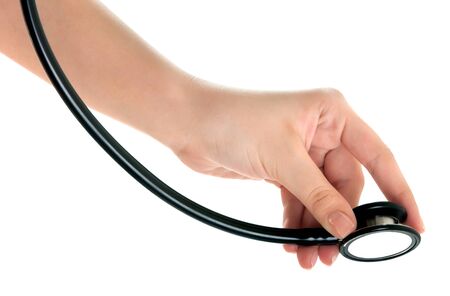 Doctor's hands holding stethoscope.Studio shot isolated on whiteの写真素材