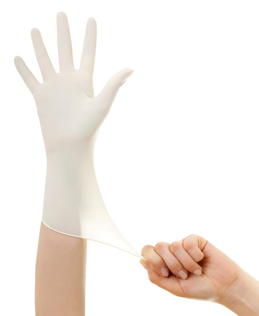 Doctor show hands with sterile gloves isolated on white. Medical advertising concept.の写真素材