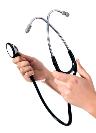 Doctor's hands holding stethoscope.Studio shot isolated on whiteの写真素材