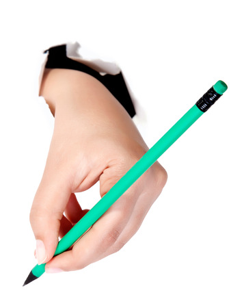 Hand writing on copy space. Beautiful female hand holding black marker pen . Brightly lit with backlight and isolated on white background.の写真素材