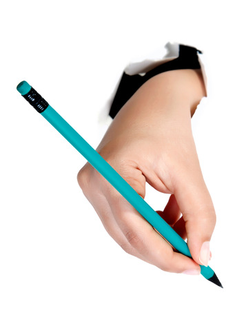 Hand writing on copy space. Beautiful female hand holding black marker pen . Brightly lit with backlight and isolated on white background.の写真素材