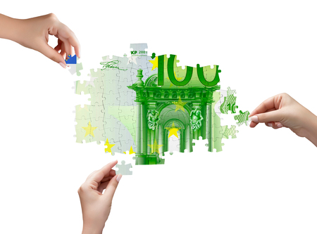 Hands and money puzzle isolated on white backgroundの写真素材