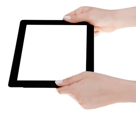 Hand holding a tablet computer with white screen. Woman hands showing empty screen of modern digital tablet. Hand holding tablet pc isolated on white background with blank screen.の写真素材