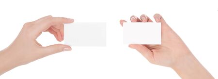 Woman hand hold virtual business card, credit card or blank paper isolated on white background.Clipping path included.Hand holding blank business card with clipping pathsの写真素材
