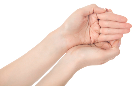 Stretched hand of woman isolated over white background. Open palm hand gesture of woman hand. Close up of open palm isolated over white background.の写真素材