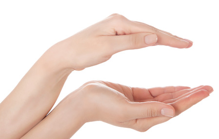 Stretched hand of woman isolated over white background. Open palm hand gesture of woman hand. Close up of open palm isolated over white background.の写真素材