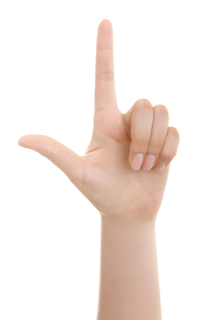 Woman hand pointing up with index finger or touching screen back hand side isolated on white background.の写真素材