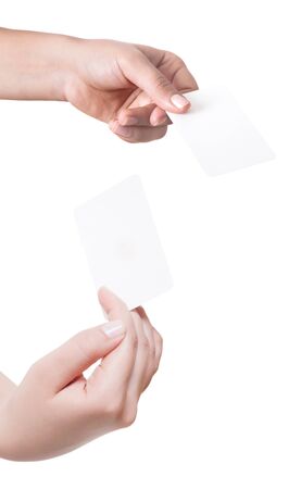 Woman hand hold virtual business card, credit card or blank paper isolated on white background.Clipping path included.Hand holding blank business card with clipping pathsの写真素材