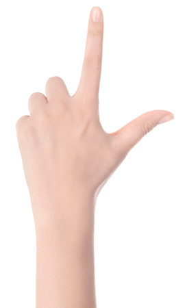 Woman hand pointing up with index finger or touching screen back hand side isolated on white background.の写真素材