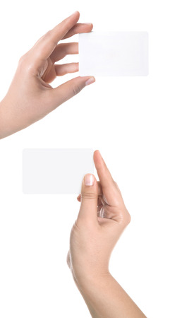 playing cards in hand isolated on white backgroundの写真素材
