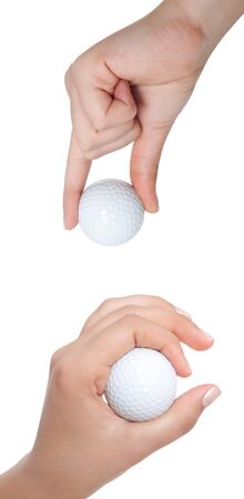 hand holds a ball for golf is isolated on a white backgroundの写真素材