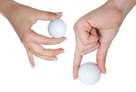 hand holds a ball for golf is isolated on a white backgroundの写真素材