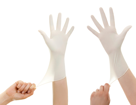 Doctor show hands with sterile gloves isolated on white. Medical advertising concept.の写真素材