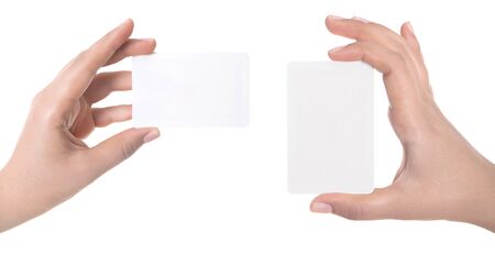 Woman hand hold virtual business card, credit card or blank paper isolated on white background.Clipping path included.Hand holding blank business card with clipping pathsの写真素材