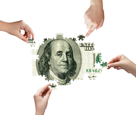 Hands and money puzzle isolated on white backgroundの写真素材