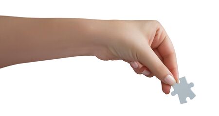 Human Hand Holding Puzzle Pieceの写真素材