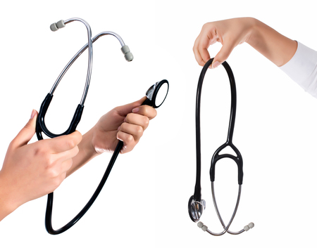 Doctor's hands holding stethoscope.Studio shot isolated on whiteの写真素材