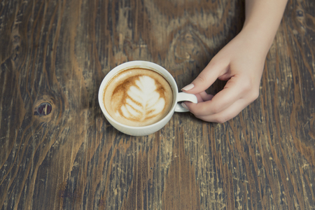 Lonely woman drinking coffee in the morningの写真素材