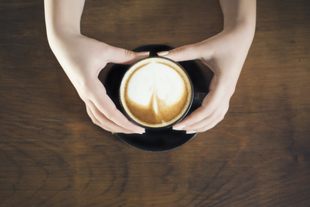 Lonely woman drinking coffee in the morningの写真素材