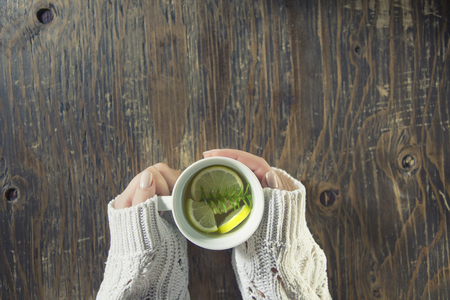 Cup of tea with thyme herb and lemon slicesの写真素材