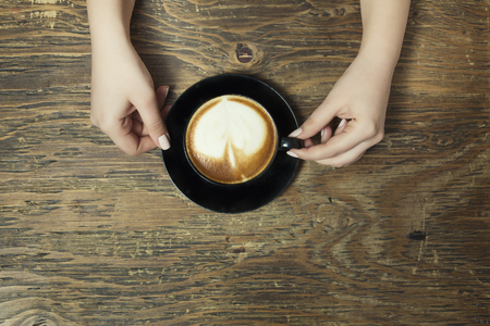 Lonely woman drinking coffee in the morningの写真素材
