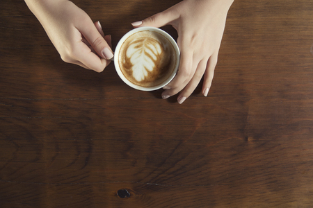 Lonely woman drinking coffee in the morningの写真素材