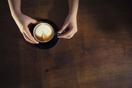 Lonely woman drinking coffee in the morningの写真素材