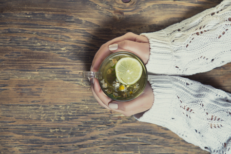 Cup of tea with thyme herb and lemon slicesの写真素材