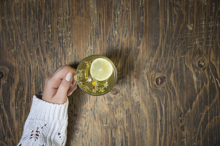 Cup of tea with thyme herb and lemon slicesの写真素材