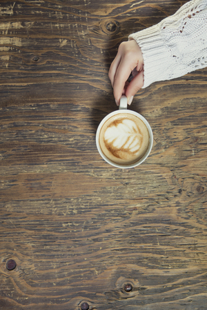 Lonely woman drinking coffee in the morningの写真素材
