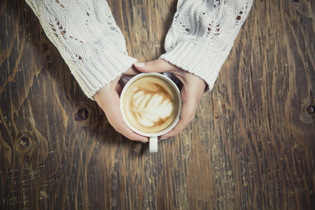 Lonely woman drinking coffee in the morningの写真素材