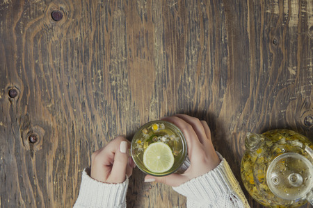 Cup of tea with thyme herb and lemon slicesの写真素材
