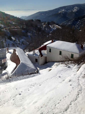 snow scene with cottage houses covered by snowの写真素材