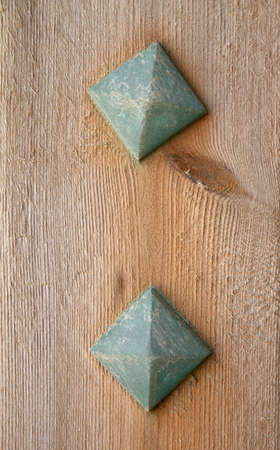 square rusty nails in wooden boardの写真素材