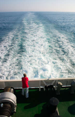 solitude man on board a liner in open seaの写真素材