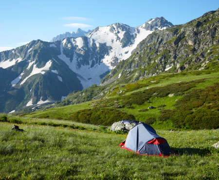 Camp on meadow in the high mountainsの写真素材