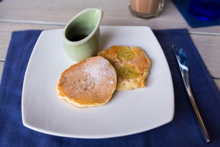 pancake honey set on white dish as breakfast