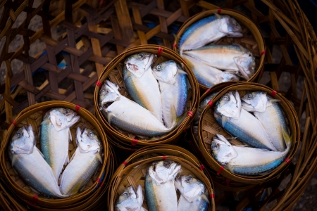 Mackerel fish in bamboo basket in Thailand urban marketの写真素材