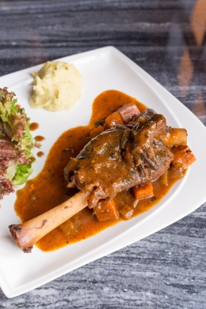 Grilled German pig leg with black pepper sauceの写真素材