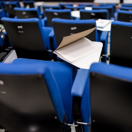 Book on the table of lecture chair in cenferences roomの写真素材
