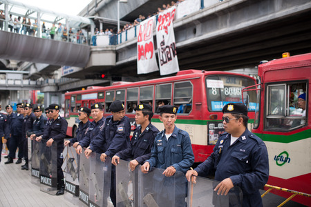 BANGKOK - September 22   Line of policemen as Stop EHIA campaign at Pathum Wan Intersection in Bangkok, Thailand のeditorial素材
