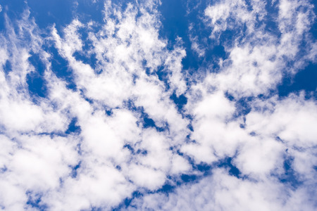 Cloud scape on vivid blue sky
